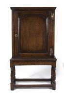 An oak boot cupboard-on-stand, 18th century and later