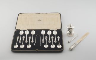 A cased set of twelve Scottish silver teaspoons and a pair of sugar tongs, T S Cuthbert, Glasgow, 1937