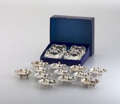 A set of eighteen novelty silver-plated place card holders, 20th century