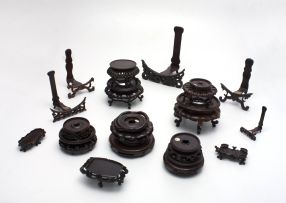 A miscellaneous group of Chinese carved hardwood stands, 20th century