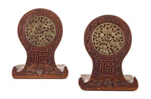 A pair of Chinese hardwood, jade and brass bookends, early 20th century