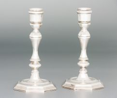 A pair of German silver candlesticks, with import marks for South Africa, post 1975, .925 standard