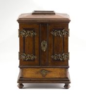 A late Victorian/early Edwardian walnut cigar cabinet