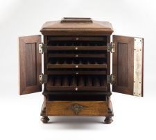 A late Victorian/early Edwardian walnut cigar cabinet