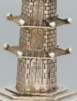 A pair of Chinese silver pepper casters, maker's initials 'HMS