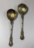 A pair of Victorian silver-gilt Chased Vine pattern serving spoons, Holland, Aldwinckle & Slater, London, 1895