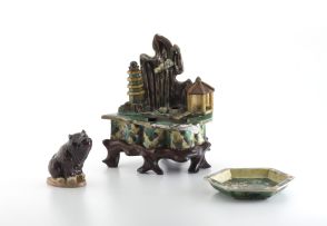 A Chinese Sancai glazed water dropper in the form of a grotto, Qing Dynasty, 17th century