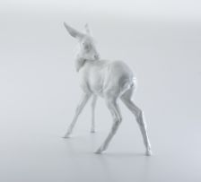 A Meissen white-glazed figure of a fawn deer, 20th century