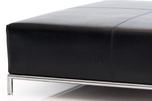 An Italian black leather ottoman, modern