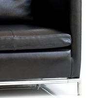 A pair of Italian black leather armchairs, modern
