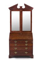 A George III mahogany bureau-cabinet