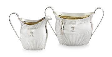 A George III silver two-handled sugar bowl and milk jug, maker's mark indistinct, London, 1801