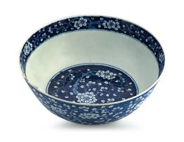 A Chinese blue and white 'prunus' bowl, Qing Dynasty, 19th century