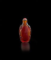 A Chinese amber glass snuff bottle, late 19th/early 20th century