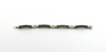 A Chinese silver-mounted jade bracelet