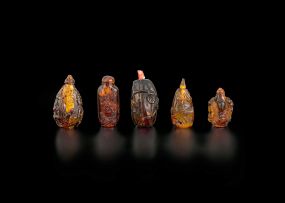 Five Chinese amber snuff bottles, early 20th century