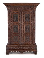 An Italian carved oak cupboard, 19th century