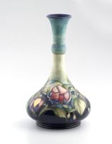 A William Moorcroft stylised fuschia bottle vase, (1928-1953)