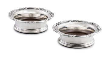 A pair of Victorian silver-plated wine coasters