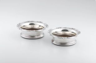 A pair of Victorian silver-plated wine coasters