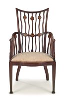 An Edwardian mahogany Arts and Crafts armchair