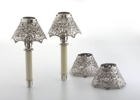 A pair of American silver-plate candle holders with four late Victorian silver shades, London, William Comyns & Sons, 1893