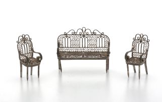 A miniature silver-plate filigree three-piece salon suite, apparently unmarked, possibly Ceylon, early 20th century
