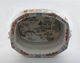 A Staffordshire earthenware transfer-printed and enamel footbath, 19th century