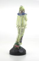 A Goldscheider figurine dressed as a jester, 20th century