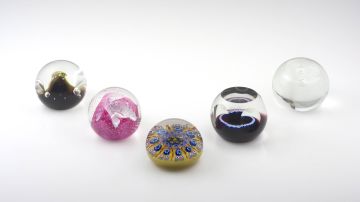 Four Scottish Caithness glass paperweights, modern