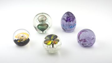 Five glass paperweights, modern
