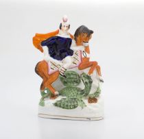 A Victorian Staffordshire figure group of ‘Saint George and the Dragon’