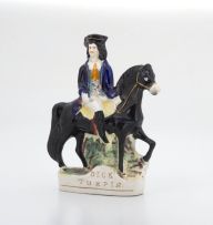 A Victorian Staffordshire figure of Tom King