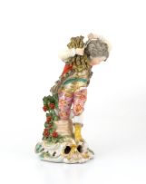 A French porcelain figure of a young boy emblematic of Winter, Samson, Paris, late 19th century