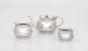 A Victorian bachelor’s three-piece silver tea service, with French import marks, Elkington & Co Ltd, Birmingham, 1893-1895