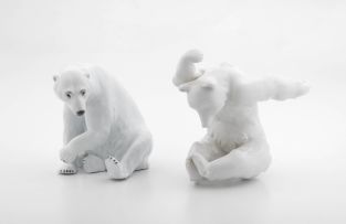 A KPM Berlin white-glazed figure of a tumbling polar bear, 20th century