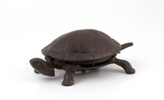 A black-painted cast-iron desk bell in the form of a tortoise, late 19th century