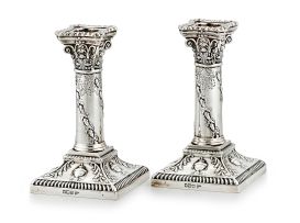 A pair of Edward VII silver candlesticks, Walker & Hall, Sheffield, 1904