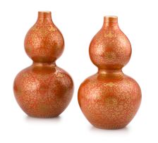 A pair of Chinese burnt-orange-glazed and gilt double-gourd vases