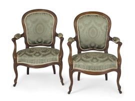A pair of walnut and upholstered armchairs,19th century
