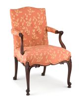 A George III mahogany and upholstered armchair