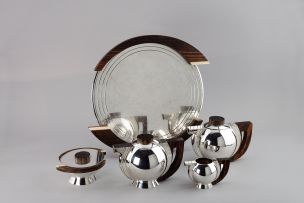 A French Art Deco five-piece electroplate, macassar and ivory tea service, circa 1925