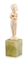 A carved ivory figure of a little girl, early 20th century