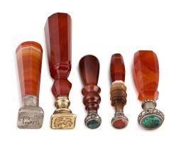 Three late Victorian carved carnelian agate and silvered-metal seals