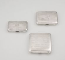 A group of three George V silver cigarette cases, Birmingham, 1917-1919