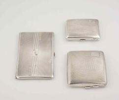 A group of three George V silver cigarette cases, Birmingham, 1932-1946