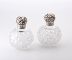 A pair of Victorian silver-mounted and glass scent bottles, Charles Asprey & Charles Asprey Junior, London, 1884