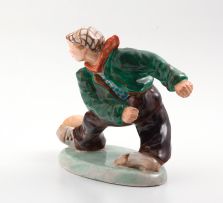 A Wedgwood & Co earthenware figure playing soccer, circa 1908