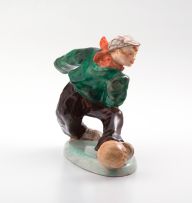 A Wedgwood & Co earthenware figure playing soccer, circa 1908