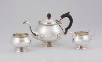 A George V three-piece silver bachelor’s tea set, Mappin & Webb Ltd, Birmingham, 1926